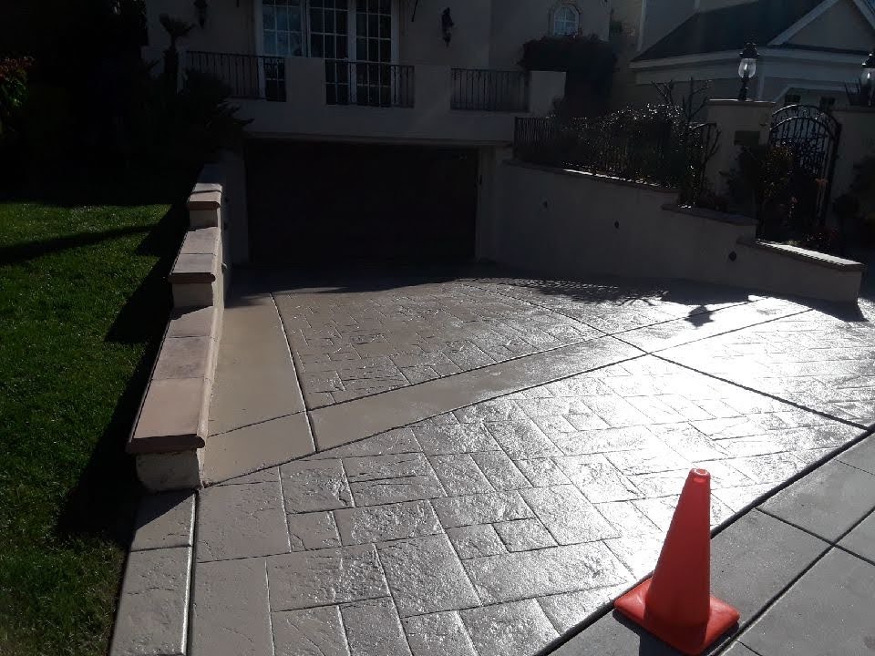 Stamped concrete driveway beige staining color