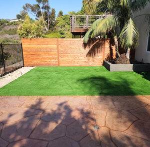Turf installation fence and stamped concrete