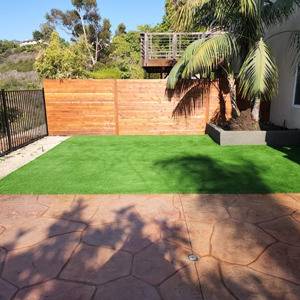 Turf installation fence and stamped concrete