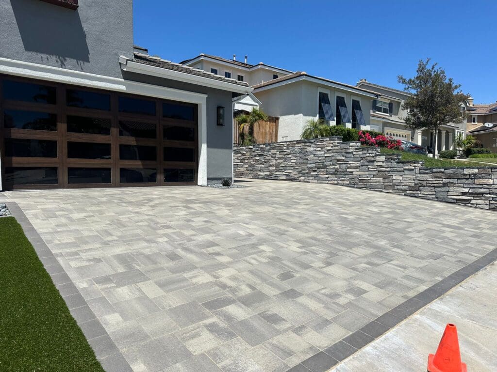 alt="Driveway pavers installation and sealing"