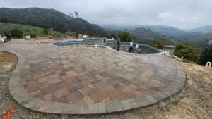 Backyard pool deck concrete pavers deck with a pool backyard installation 